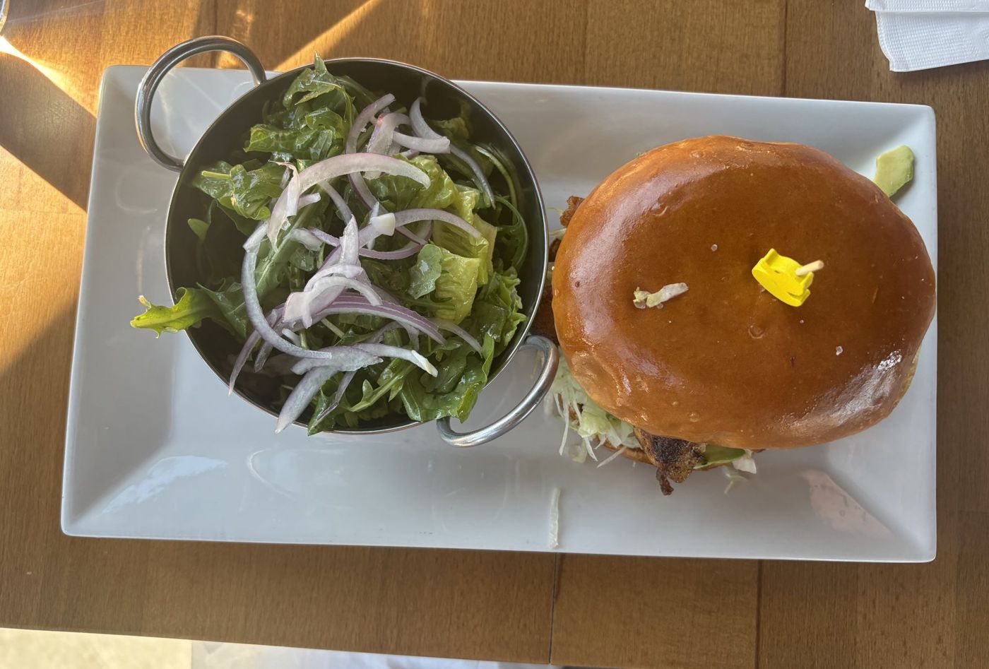 Grilled chicken sandwich with side salad at Able Baker Centennial Hills